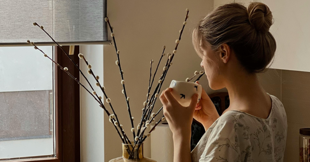 Woman Sips Coffee Looking Out, Reflective - Depression Treatment Chandler, AZ
