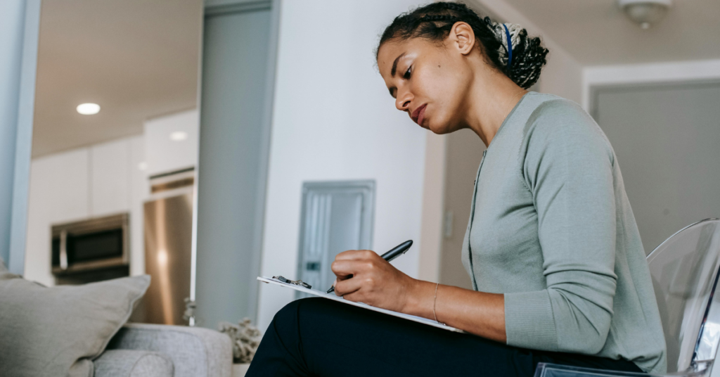 Woman fills out form in professional medical office setting - Depression Treatment Chandler, AZ