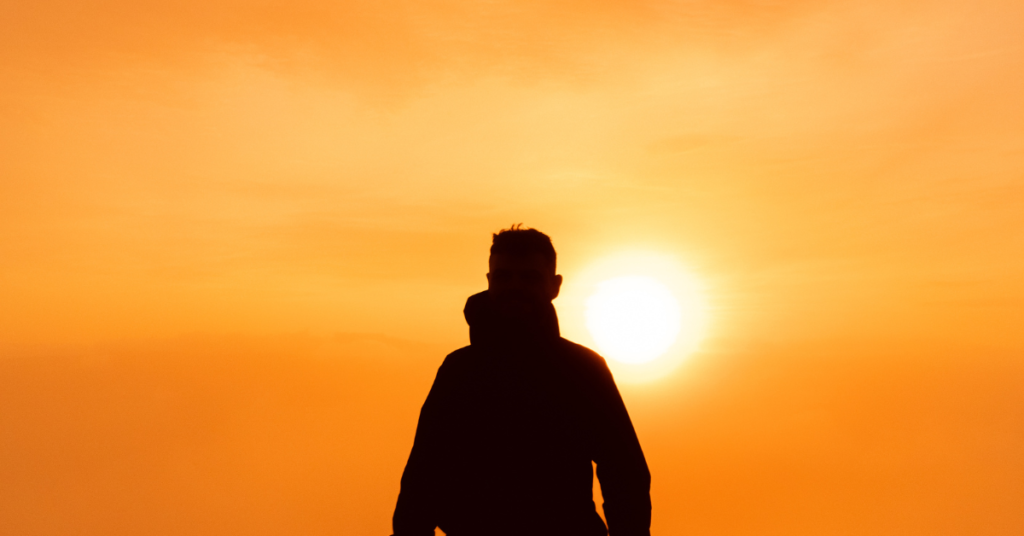 Silhouette of man overlooking sunrise PTSD Therapy in Chandler, AZ
